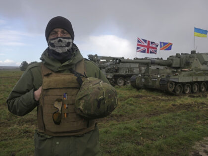 An Ukrainian soldier takes part in a military exercise at a military training camp in an u