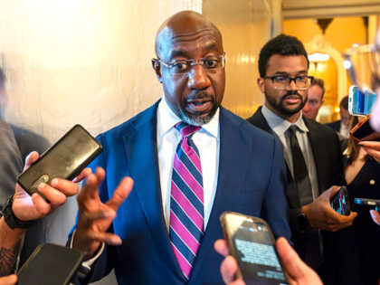 Sen. Raphael Warnock, D-Ga., speaks with reporters, Sept. 28, 2023, in Washington. Senior