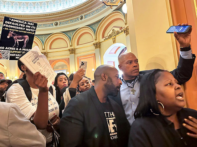 Members of Coalition for a Just and Equitable California protest and demand lawmakers to t