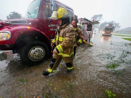 Morgan City firefighters respond to a home fire during Hurricane Francine in Morgan City,