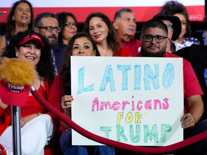 Supporters hold a sign before Republican presidential nominee former President Donald Trum