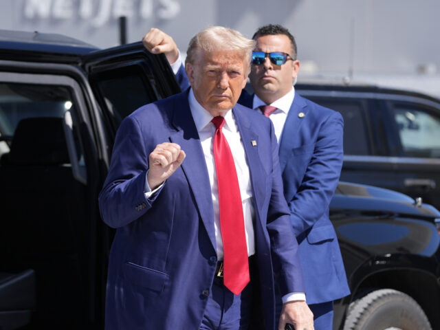 Republican presidential nominee former President Donald Trump gestures as he arrives at Ha