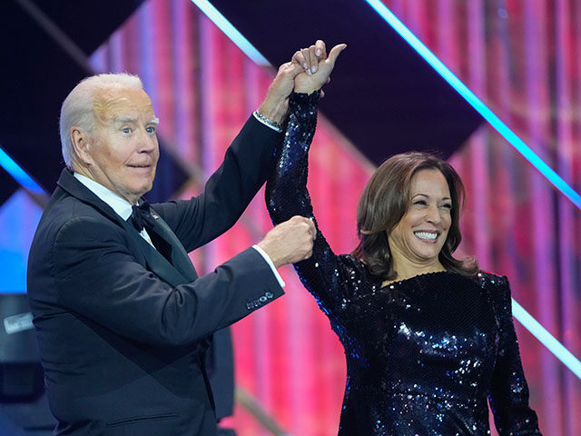 Trump - President Joe Biden, left, holds up the arm of Democratic presidential nominee Vic