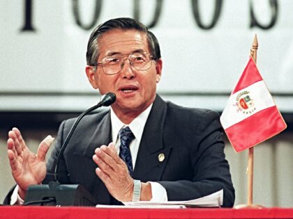 Peruvian President Alberto Fujimori answers questions during a press conference at the sit