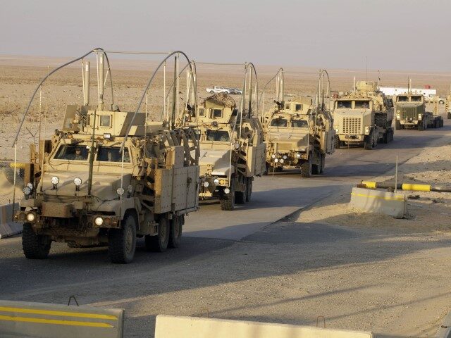 The last vehicles in a convoy of the U.S. Army's 3rd Brigade, 1st Cavalry Division cr