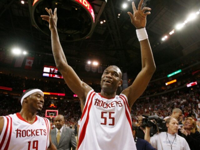 Houston Rockets' Dikembe Mutombo (55) celebrates the Rockets win over the Charlotte B