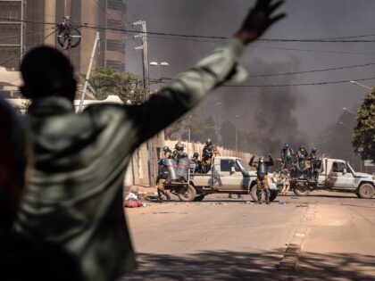 Protestors face security forces firing tear gas during a demonstration in Ouagadougou on N