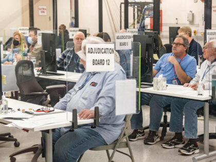 Election workers handle ballots for the US midterm election, in the presence of observers