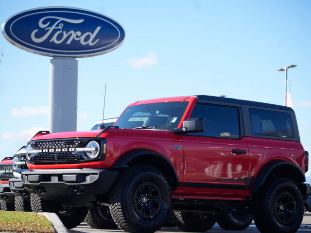 Unsold 2022 Bronco sports-utility vehicles sit Thursday, Nov. 25, 2022, outside a Ford dea