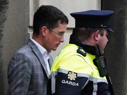 Irish schoolteacher Enoch Burke (left) leaving the High Court, Dublin, to return to Mountj