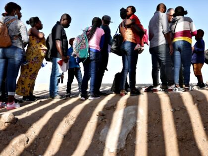 YUMA, ARIZONA- MAY 20: Immigrants from Haiti, who crossed through a gap in the U.S.-Mexico