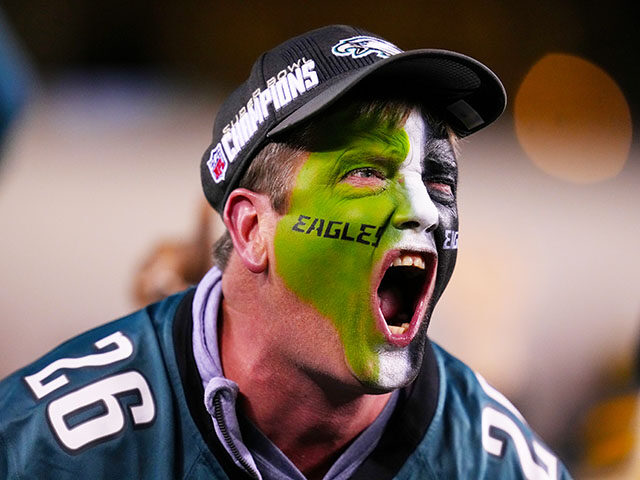 A Philadelphia Eagles fan cheers during the first half of the game between the Green Bay P