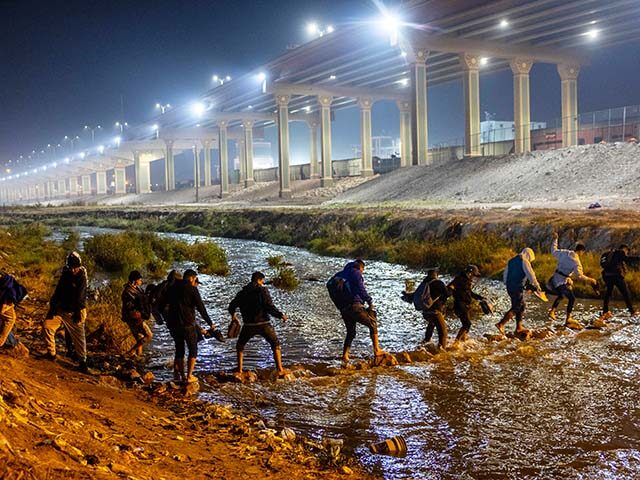 Immigrants cross the Rio Grande into El Paso, Texas to seek political asylum on December 1