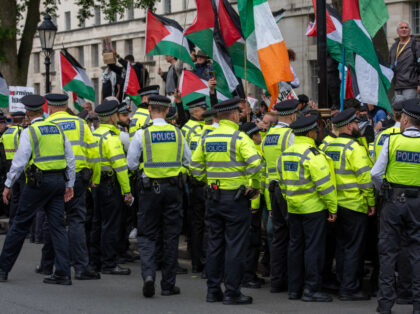 LONDON, UNITED KINGDOM - 2024/07/06: Police officers clear off the road from the protester