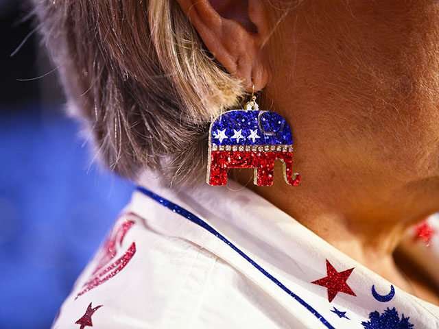 A woman wears GOP themed elephant earrings on the first day of the Republican National Con