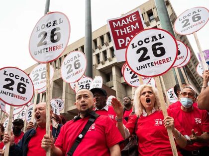 People rally at a press conference after a strike authorization vote by UNITE HERE Local 2