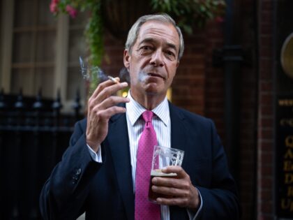 LONDON, ENGLAND - AUGUST 29: Reform UK leader Nigel Farage smokes a cigarette and drinks a