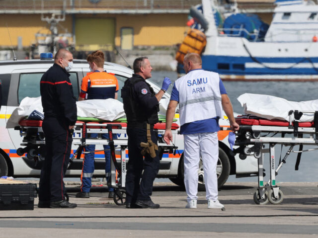 TOPSHOT - Firefighters, a police officer and a doctor of the SAMU emergency unit stand nex