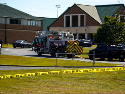 A police line is put up in front of Apalachee High School after a school shooting took pla