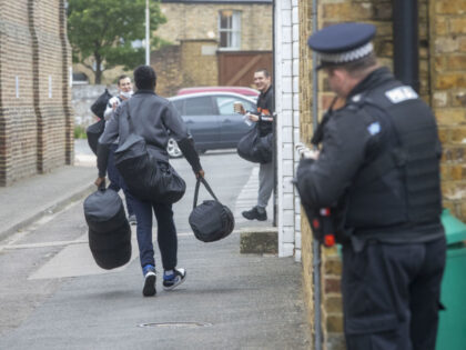 People seen outside HM Prison Brixton in London. Around 1,700 inmates are expected to be l