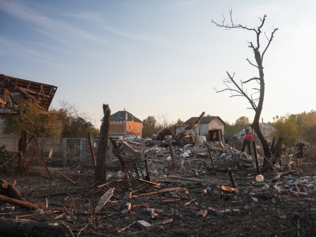 SUMY, UKRAINE - SEPTEMBER 21: The Honcharenko family sorts through the rubble at their cot