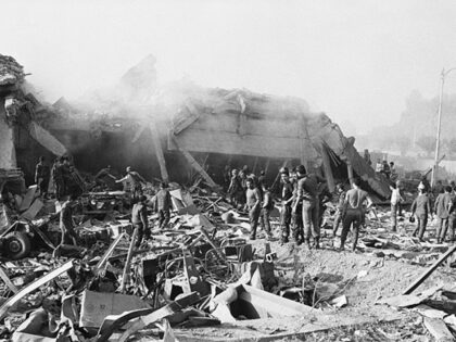 Hezbollah - Workers sift through the rubble of a US marine barracks in Beirut, Lebanon whi