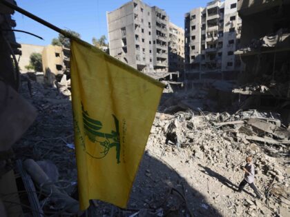 A Hezbollah flag at the site of the assassination of Hezbollah leader Hassan Nasrallah in