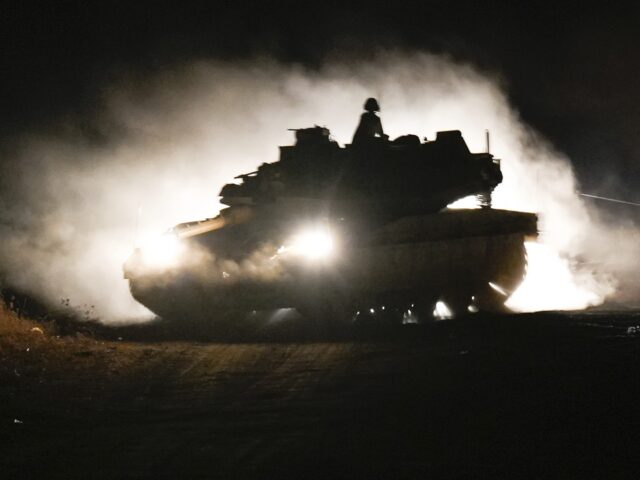 An Israeli tank manoeuvres in northern Israel near the Israel-Lebanon border, Monday, Sept