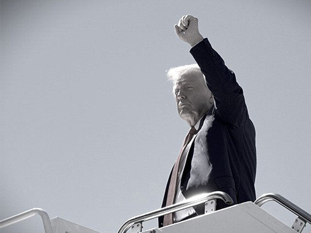 Republican presidential nominee former President Donald Trump gestures as he boards a plan