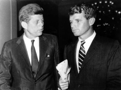 Massachusetts Sen. John F. Kennedy, left, discusses campaign matters with his brother and