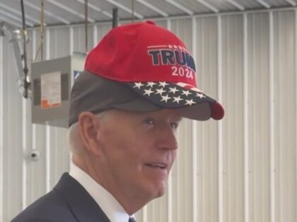 Joe Biden dons Trump hat