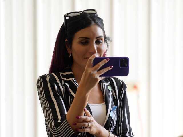 Laura Loomer watches as Republican presidential nominee former President Donald Trump visi