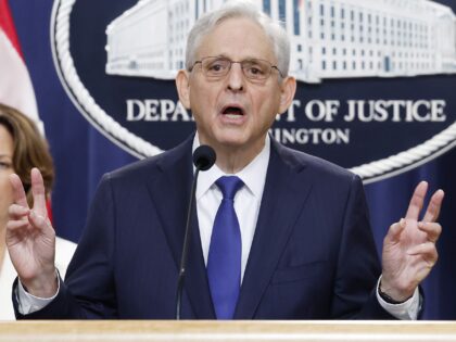 WASHINGTON, DC - AUGUST 23: U.S. Attorney General Merrick Garland (C) speaks alongside U.S