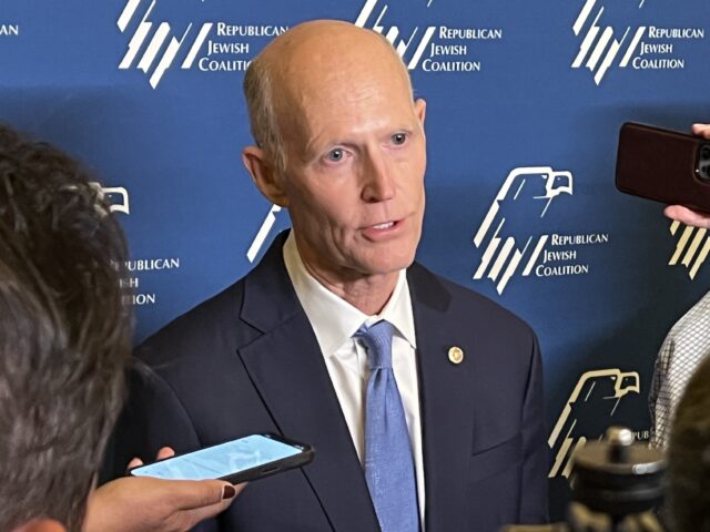 Sen. Rick Scott (R-FL) speaks with reporters at the Republican Jewish Coalition annual lea