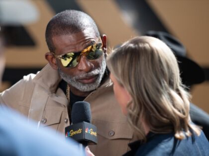 LINCOLN, NEBRASKA - SEPTEMBER 7: Head coach Deion Sanders of the Colorado Buffaloes answer