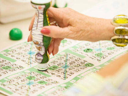 Woman playing bingo - stock photo