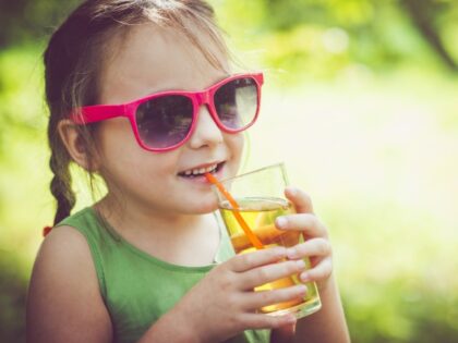 child drinking juice