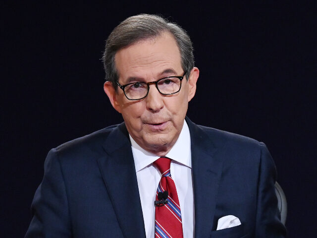 CLEVELAND, OHIO - SEPTEMBER 29: Debate moderator and Fox News anchor Chris Wallace directs