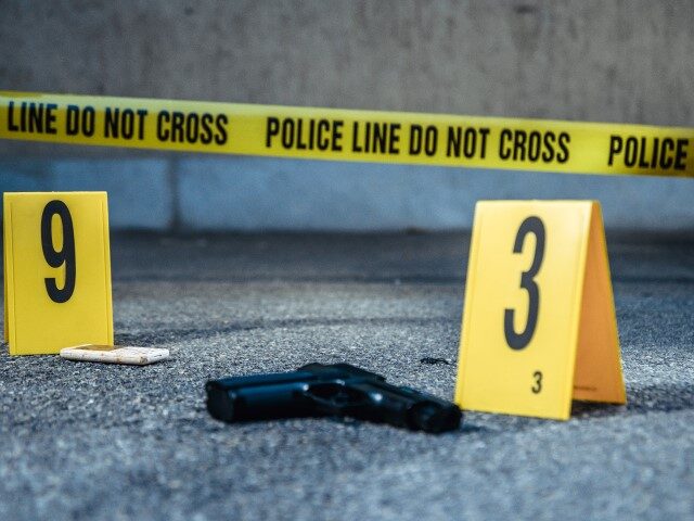 crime scene tape and gun