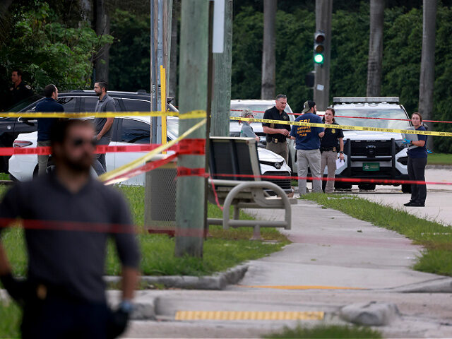 WEST PALM BEACH, FLORIDA - SEPTEMBER 15: Law enforcement personnel investigate the area ar