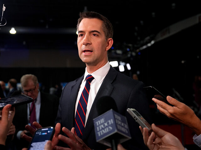 Sen. Tom Cotton, R-Ark., speaks to reporters in the spin room before a presidential debate