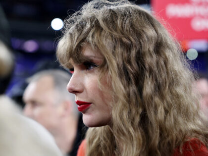 BALTIMORE, MARYLAND - JANUARY 28: Taylor Swift celebrates on the field after the Kansas Ci