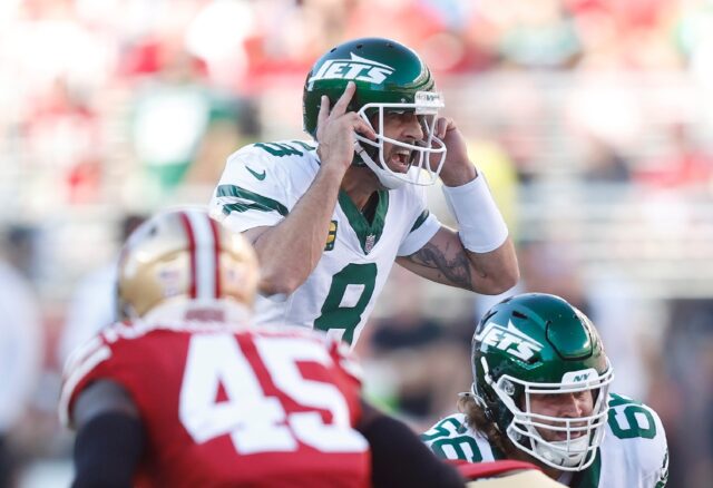 Aaron Rodgers calls a play for the New York Jets in their loss to San Francisco