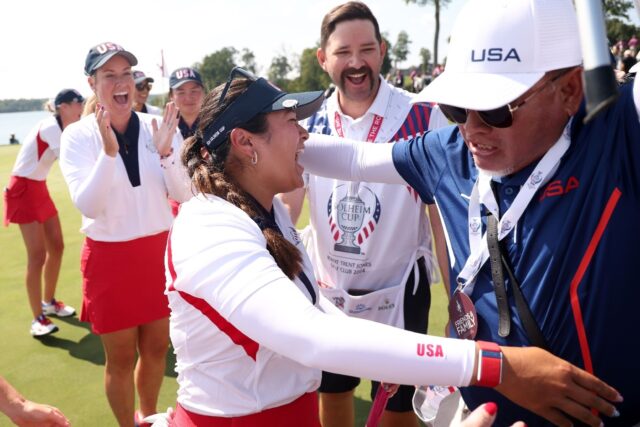 American Lilia Vu celebrates with the US team after scoring the deciding half-point to win