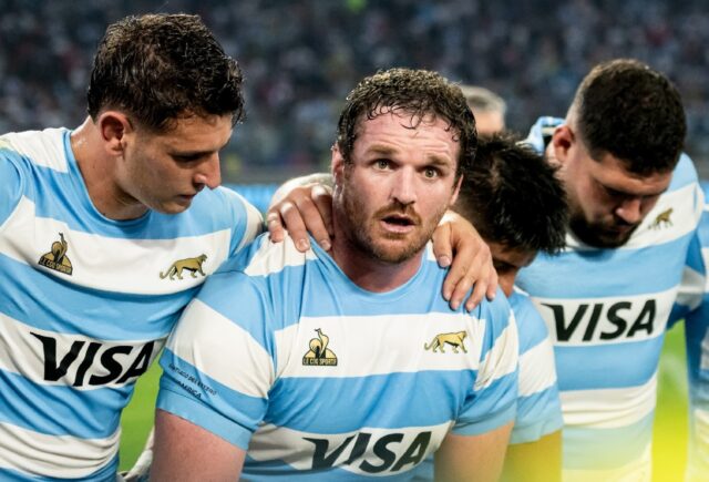 Argentina captain Julian Montoya (C) talks to teammates after a victory over South Africa