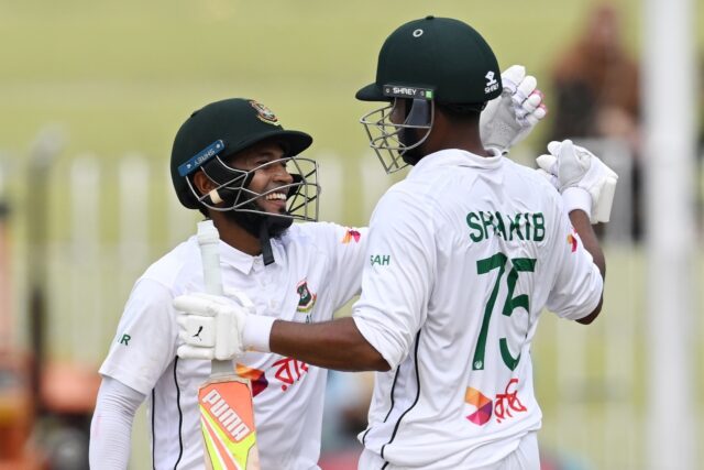 Bangladesh's Mushfiqur Rahim (L) and Shakib Al Hasan celebrate after winning the second Te