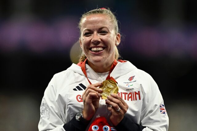 Britain's Hannah Cockcroft celebrates after winning her wheelchair sprint event at a fourt