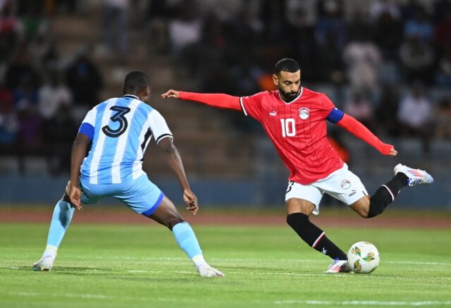 Egypt captain Mohamed Salah (R) shoots during a 2025 Africa Cup of Nations qualifier again