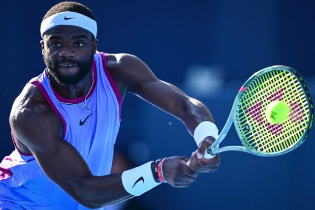 Frances Tiafoe hits a return to Brandon Nakashima at the Japan Open