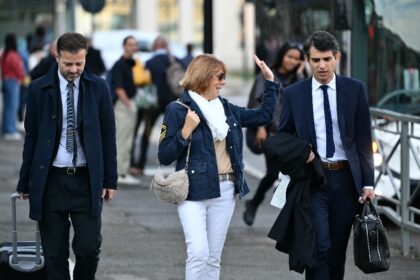 Gisele Pelicot walks with her lawyers as they arrive at the courthouse in the southeastern